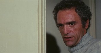 Movie still from “Your Vice Is a Locked Room and Only I Have the Key” (1972), directed by Sergio Martino – A person looking at the camera; Close Up shot, Low angle