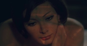 Movie still from “Your Vice Is a Locked Room and Only I Have the Key” (1972), directed by Sergio Martino – A woman's face in the dark; Close Up shot, High angle
