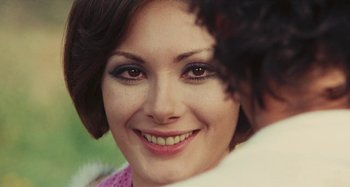 Movie still from “Your Vice Is a Locked Room and Only I Have the Key” (1972), directed by Sergio Martino – A woman's face with makeup on; Close Up shot, Over the shoulder angle
