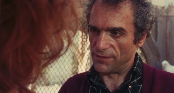 Movie still from “Your Vice Is a Locked Room and Only I Have the Key” (1972), directed by Sergio Martino – A person looking at the camera; Close Up shot, Over the shoulder angle