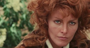 Movie still from “Your Vice Is a Locked Room and Only I Have the Key” (1972), directed by Sergio Martino – A woman's face with red curly hair; Close Up shot, Low angle
