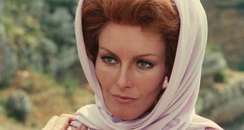 Movie still from “Your Vice Is a Locked Room and Only I Have the Key” (1972), directed by Sergio Martino – A person wearing a head scarf; Close Up shot, Low angle