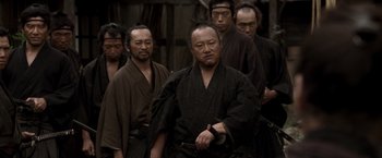 A group of men in traditional japanese garb standing together