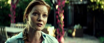 Movie still from “13 Hours” (2016), directed by Michael Bay – A person wearing a white shirt; Close Up shot, Over the shoulder angle