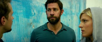 Movie still from “13 Hours” (2016), directed by Michael Bay – A man with a goatee and a beard looking to his left; Close Up shot, Low angle