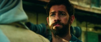 Movie still from “13 Hours” (2016), directed by Michael Bay – A person with a beard; Close Up shot, Low angle