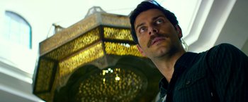 Movie still from “13 Hours” (2016), directed by Michael Bay – A person looking up at the sky; Close Up shot, Low angle