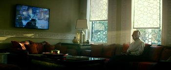 Movie still from “13 Hours” (2016), directed by Michael Bay – A living room filled with furniture next to a large window; Wide shot, Low angle