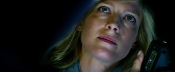 Movie still from “13 Hours” (2016), directed by Michael Bay – A woman's face in the dark; Close Up shot, Low angle