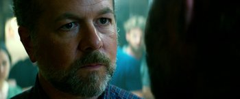 Movie still from “13 Hours” (2016), directed by Michael Bay – A person with a beard; Close Up shot, Over the shoulder angle