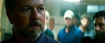 Movie still from “13 Hours” (2016), directed by Michael Bay – A person with a beard; Close Up shot, Over the shoulder angle