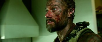 Movie still from “13 Hours” (2016), directed by Michael Bay – A person with a beard; Close Up shot, Low angle