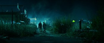 Movie still from “13 Hours” (2016), directed by Michael Bay – Two people walking down a dark path at night; Extreme Wide shot, Low angle