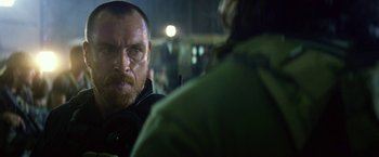 Movie still from “13 Hours” (2016), directed by Michael Bay – A person talking to another person; Close Up shot, Over the shoulder angle