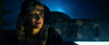 A woman sitting in a car at night