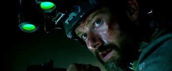 Movie still from “13 Hours” (2016), directed by Michael Bay – A person with a helmet on; Close Up shot, Low angle