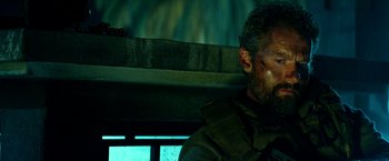 Movie still from “13 Hours” (2016), directed by Michael Bay – A person sitting in a vehicle; Close Up shot, Over the shoulder angle