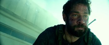 Movie still from “13 Hours” (2016), directed by Michael Bay – A person with a beard; Close Up shot, Low angle