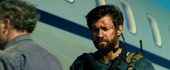 Movie still from “13 Hours” (2016), directed by Michael Bay – A person with a beard; Close Up shot, Low angle