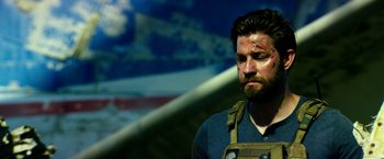 Movie still from “13 Hours” (2016), directed by Michael Bay – A person with a beard; Close Up shot, Over the shoulder angle