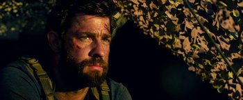 Movie still from “13 Hours” (2016), directed by Michael Bay – A person with a beard; Close Up shot, Over the shoulder angle