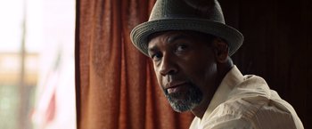 Movie still from “2 Guns” (2013), directed by Baltasar Kormákur – A person wearing a hat; Close Up shot, Low angle