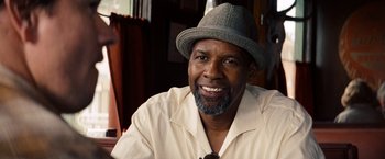 Movie still from “2 Guns” (2013), directed by Baltasar Kormákur – A person wearing a hat; Close Up shot, Over the shoulder angle