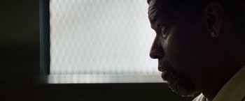 Movie still from “2 Guns” (2013), directed by Baltasar Kormákur – A man's face looking off into the distance; Close Up shot, Low angle