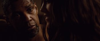 Movie still from “2 Guns” (2013), directed by Baltasar Kormákur – A person with a beard; Close Up shot, Over the shoulder angle