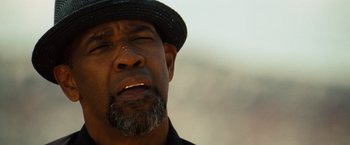 Movie still from “2 Guns” (2013), directed by Baltasar Kormákur – A person wearing a hat; Close Up shot, Low angle