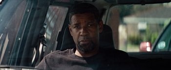 Movie still from “2 Guns” (2013), directed by Baltasar Kormákur – A person sitting in a car; Close Up shot, Over the shoulder angle