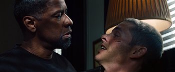 Movie still from “2 Guns” (2013), directed by Baltasar Kormákur – Two men are looking at each other in a room; Close Up shot, Over the shoulder angle