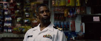 Movie still from “2 Guns” (2013), directed by Baltasar Kormákur – A man wearing a uniform in a store; Close Up shot, Low angle