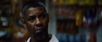 Movie still from “2 Guns” (2013), directed by Baltasar Kormákur – A person wearing a white shirt; Close Up shot, Over the shoulder angle