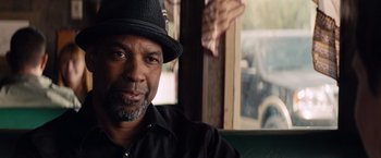 Movie still from “2 Guns” (2013), directed by Baltasar Kormákur – A person wearing a hat; Close Up shot, Over the shoulder angle