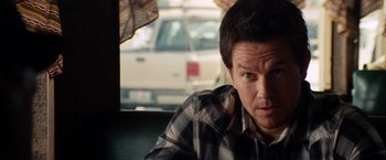 Movie still from “2 Guns” (2013), directed by Baltasar Kormákur – A person wearing a striped shirt; Close Up shot, Over the shoulder angle