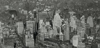 Movie still from “20th Century Women” (2016), directed by Mike Mills – An aerial view of a large city with skyscrapers; Extreme Wide shot, Overhead angle