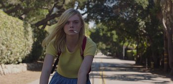 Movie still from “20th Century Women” (2016), directed by Mike Mills – A woman with a cigarette in her mouth on the side of the road; Medium shot, Low angle