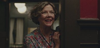 Movie still from “20th Century Women” (2016), directed by Mike Mills – A woman holding a phone up to her face; Close Up shot, Low angle