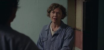 Movie still from “20th Century Women” (2016), directed by Mike Mills – A woman with short hair wearing a denim jacket; Close Up shot, Over the shoulder angle