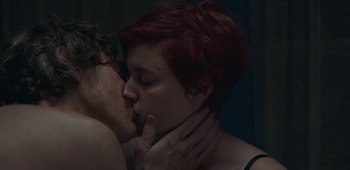 Movie still from “20th Century Women” (2016), directed by Mike Mills – A man and a woman kissing each other; Close Up shot, Low angle
