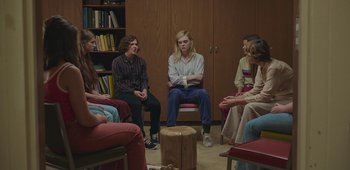 Movie still from “20th Century Women” (2016), directed by Mike Mills – A group of young people sitting in a circle; Wide shot, High angle