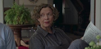 Movie still from “20th Century Women” (2016), directed by Mike Mills – An older woman sitting on a chair in front of a mirror; Close Up shot, Over the shoulder angle