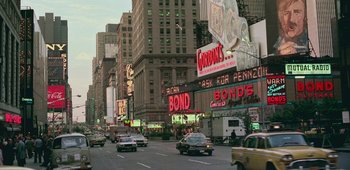 Movie still from “20th Century Women” (2016), directed by Mike Mills – A busy city street filled with lots of traffic; Extreme Wide shot, High angle