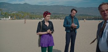 Movie still from “20th Century Women” (2016), directed by Mike Mills – A man and a woman standing on the beach; Medium shot, High angle