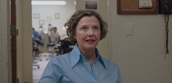 Movie still from “20th Century Women” (2016), directed by Mike Mills – A woman in a blue shirt is looking at the camera; Close Up shot, Over the shoulder angle