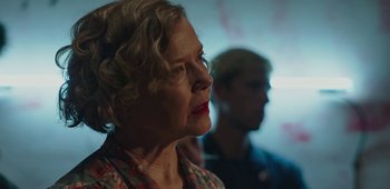 Movie still from “20th Century Women” (2016), directed by Mike Mills – An older woman with blonde curly hair looking up; Close Up shot, Low angle