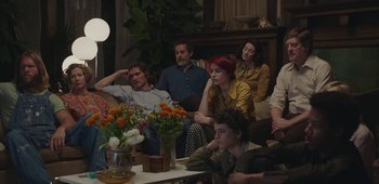 Movie still from “20th Century Women” (2016), directed by Mike Mills – A group of people sitting around a living room; Wide shot, High angle