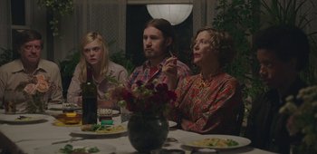 Movie still from “20th Century Women” (2016), directed by Mike Mills – A group of people sitting at a dinner table; Medium shot, Over the shoulder angle