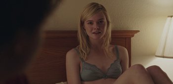 Movie still from “20th Century Women” (2016), directed by Mike Mills – A woman sitting on a bed wearing a bra; Close Up shot, Over the shoulder angle